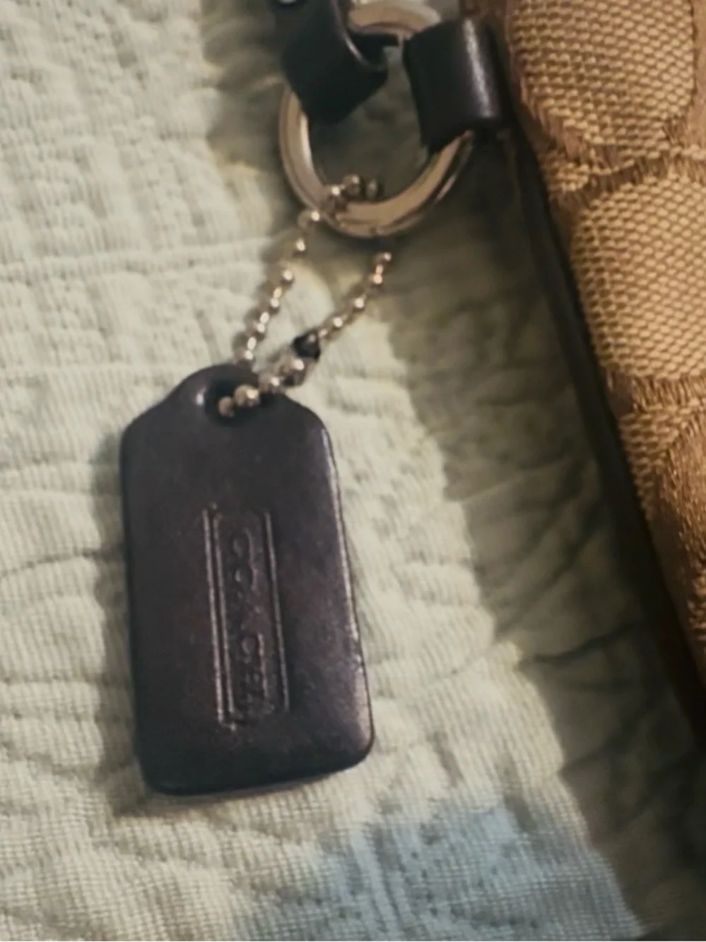 Coach Signature tan/brown canvas wristlet, w/strap, good/used.